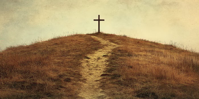 Cross at the top of a hill surrounded by golden grass under a cloudy sky creates a serene atmosphere for reflection and peace photo