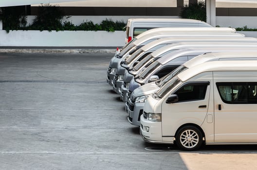 Many van parked in a row photo
