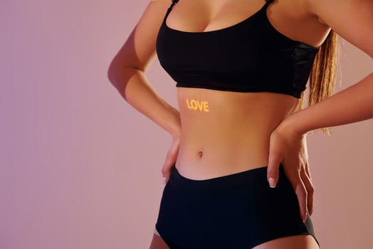 A woman in a black sports bra top and shorts photo