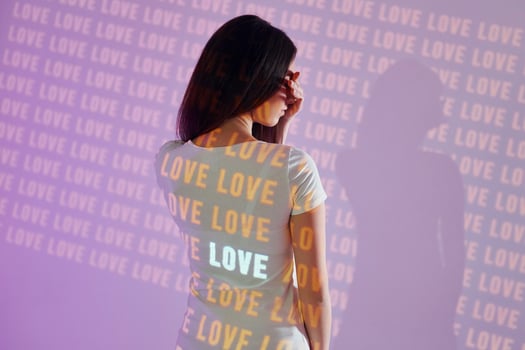 A woman wearing a t - shirt with the word love on it photo