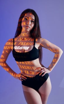 A woman in a black bikini top and underwear photo