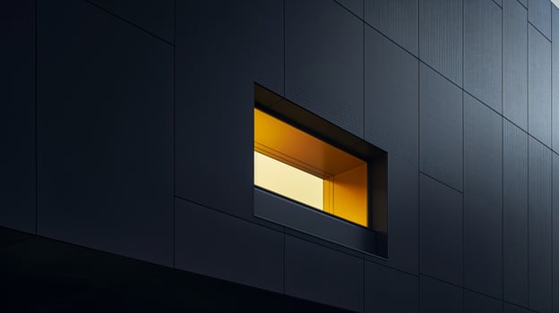 A black building with a yellow light in the window photo