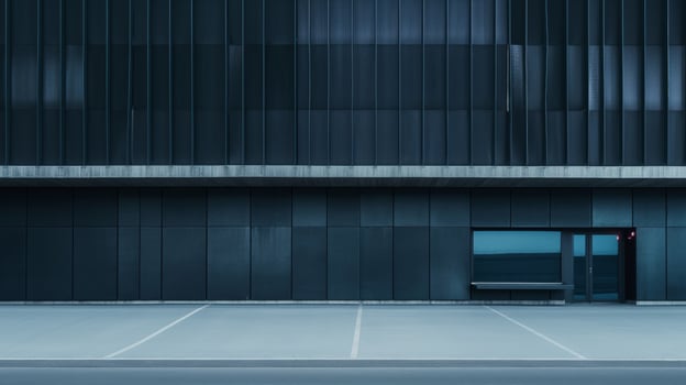 A black building with a parking lot in front of it photo