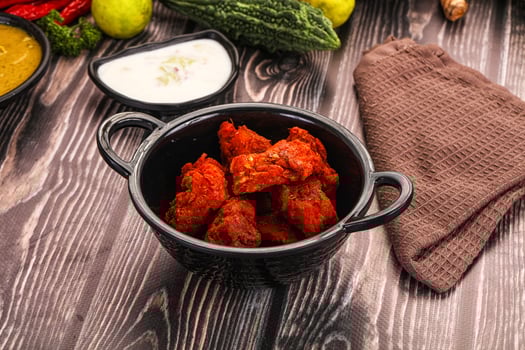 A bowl of food on a table with other food photo