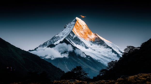 Majestic Snow Capped Mountain Peak at Sunset Golden Hour Dramatic Landscape photo