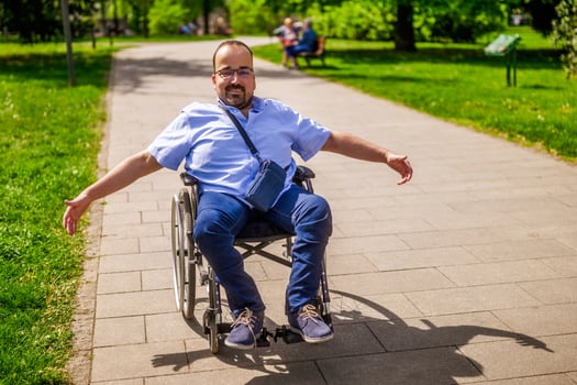Happy man in wheelchair photo