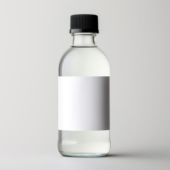A white bottle with a black cap on it photo