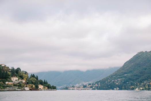 Colorful villas on wooded mountains at the foot of the lake. Como, Italy photo