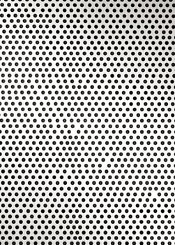 Abstract black and white polka dot pattern on a white background. Perforated Metal Texture photo