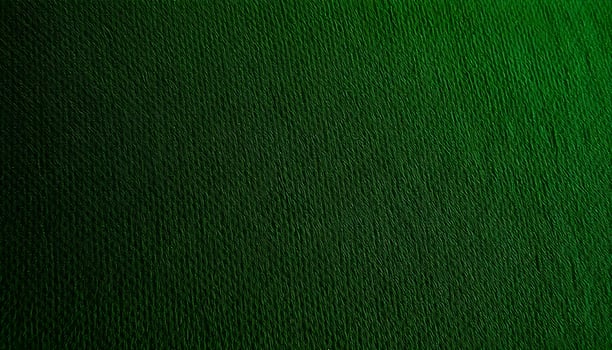 Synthetic fabric texture background showcasing a textured green upholstery fabric with visible fibers and a rich, deep color, accentuated by soft lighting photo