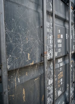 close up of old cargo container for transportation of goods, industrial background. Spiderweb scratch on Cargo Container photo