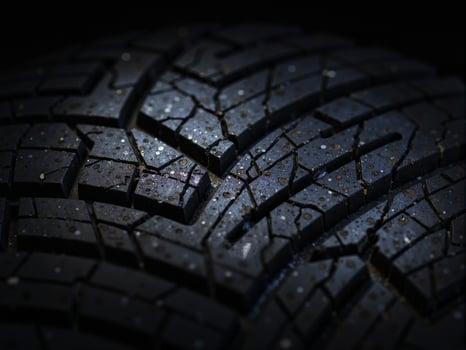 A close up of a tire with cracks on it photo