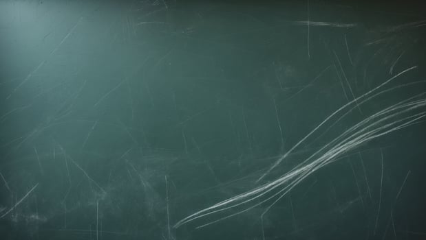 Chalkboard texture displays a dark green surface with various chalk markings. photo