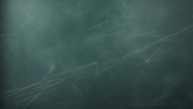 Chalkboard texture displays a dark green surface with various chalk markings photo