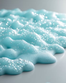 Light Blue Cleaning Foam Texture on Surface with Bubbles photo
