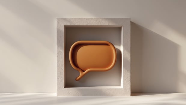 A speech bubble in a white box on a table photo