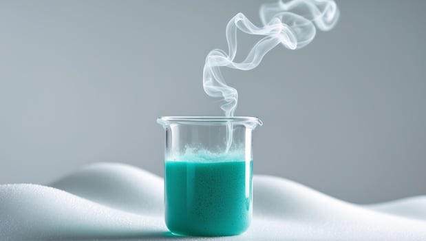 Glass beaker filled with chemical substance releasing vapor. photo