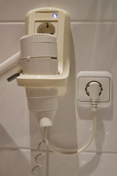 Wall-Mounted Hair Dryer with Power Outlet photo