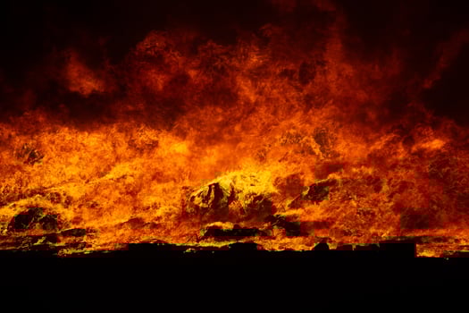 Big blaze and smoke at night. photo