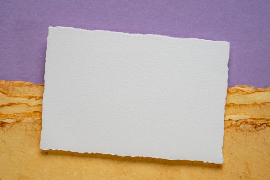blank sheet of watercolor paper on a tan toned paper photo