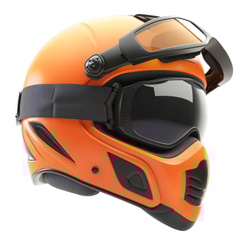 An orange ski helmet with goggles designed for winter sports enthusiasts. photo