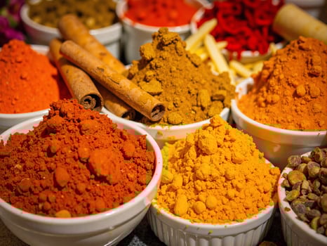 Various spices and herbs in bowls photo