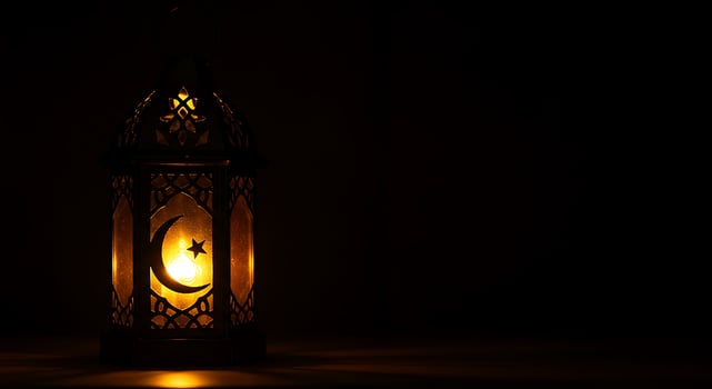 A lantern with a crescent moon on it photo