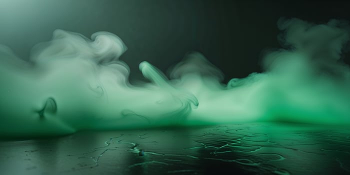 A green liquid is being sprayed into the air photo