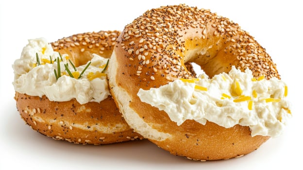 Two Delicious Everything Bagels Topped with Cream Cheese, Presenting a Mouthwatering Culinary Delight Perfect for Breakfast, Brunch, or a Quick Snack, these Bagels Showcase the Ideal Combination of photo