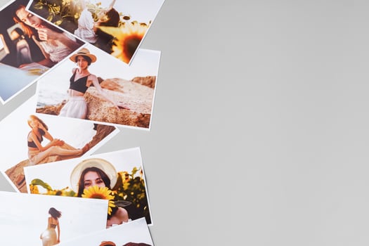 Printed colorful photos of women portraits against gray background