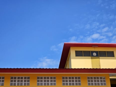 Minimal Yellow Vintage Building with Blue Sky Background. photo