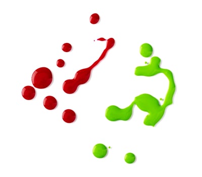 Drops of spilled nail polish over white background photo