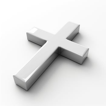 A shiny silver cross resting on a clean, white surface, symbolizing faith and spirituality. photo