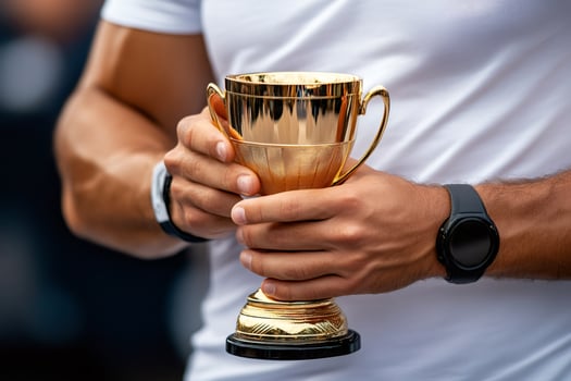 Athlete winning a gold trophy after great competition photo