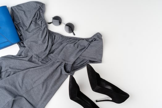 Flat lay of woman summer outfit on white background photo