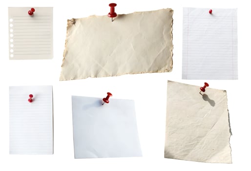 A collection of white note sheets isolated on a white background. photo