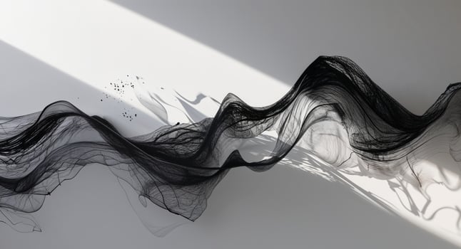 A black and white photo of a wave