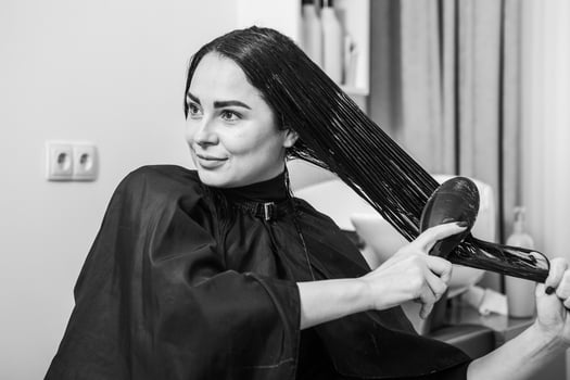 white woman washes her black hair and applies hair mask. Healthy hair photo