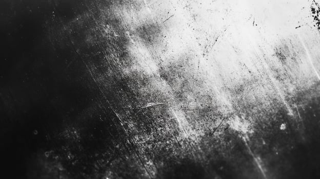 A high-contrast, black and white abstract showcasing textures and patterns, with a gradient shift from dark to bright areas and scratches photo