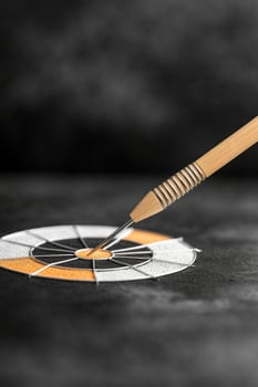 Expressing the concept of unclear goals with a simple monochromatic dartboard and smooth lines photo
