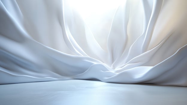 Elegant white fabric backdrop with flowing, smooth texture and subtle light play, creating a sense of purity and sophistication. photo