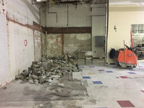 A Retail Store Having a Big Remodel with Torn Up Concrete Floor photo