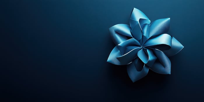 Elegant blue fabric flower arrangement on a dark background showcasing intricate design and craftsmanship photo