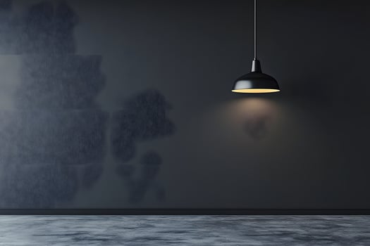 Dark room, pendant lamp, textured wall, empty floor, interior design photo
