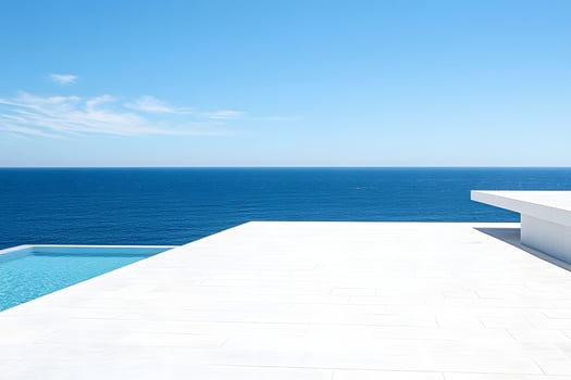 Oceanfront pool, clear sky, modern design photo
