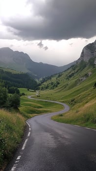 Serene Mountain Road Under Cloudy Sky - A Breathtaking Landscape photo