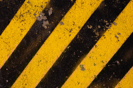 Grunge yellow and black diagonal stripes. Industrial warning background, warn caution, construction. photo