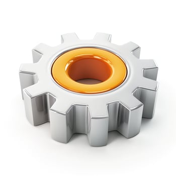 A metallic gear with an orange center, symbolizing engineering and mechanics. photo