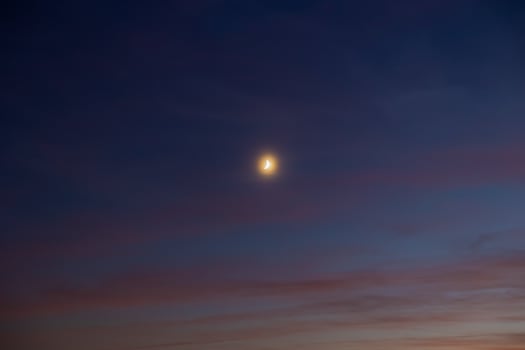 Crescent moon on the hazy sky. photo