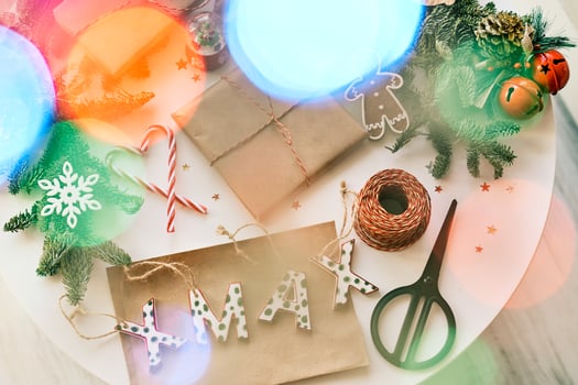 Christmas presents and decorations on table photo